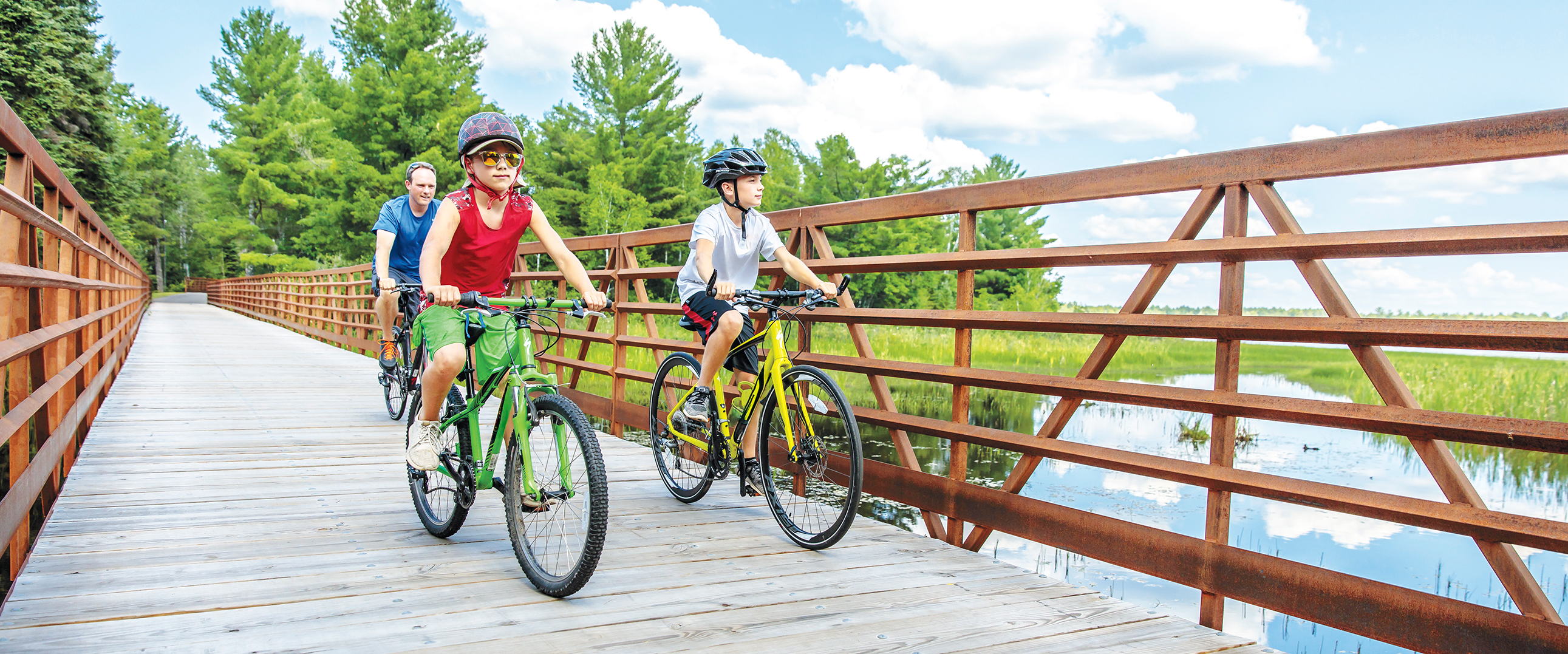 A scenic bridge spans Rice Creek along the paved bike trail.